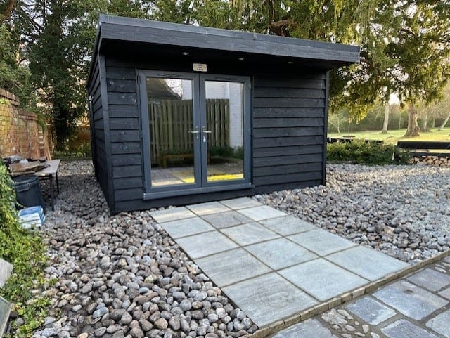 Black garden studio with patio