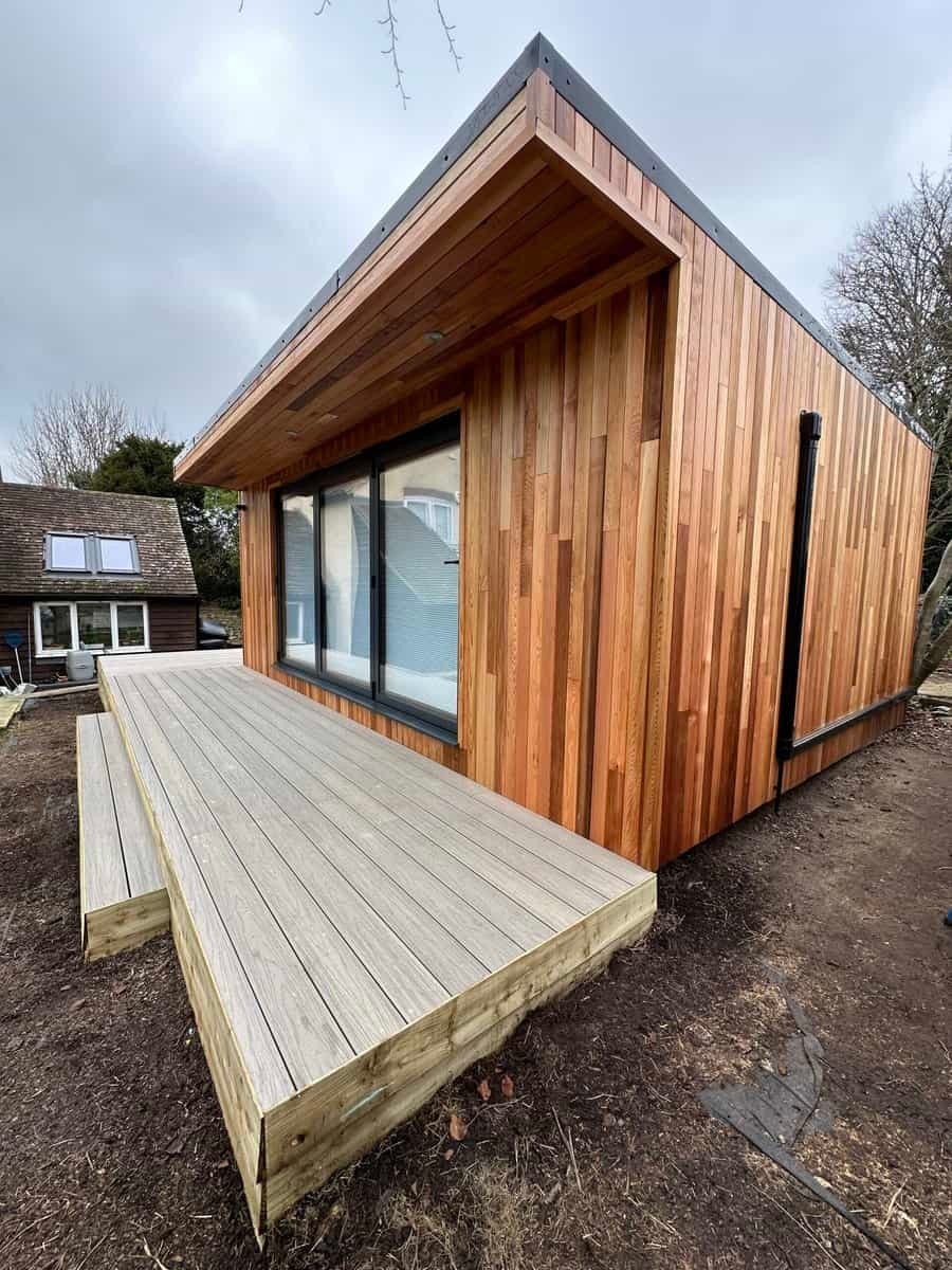 Contemporary garden room with deck extension